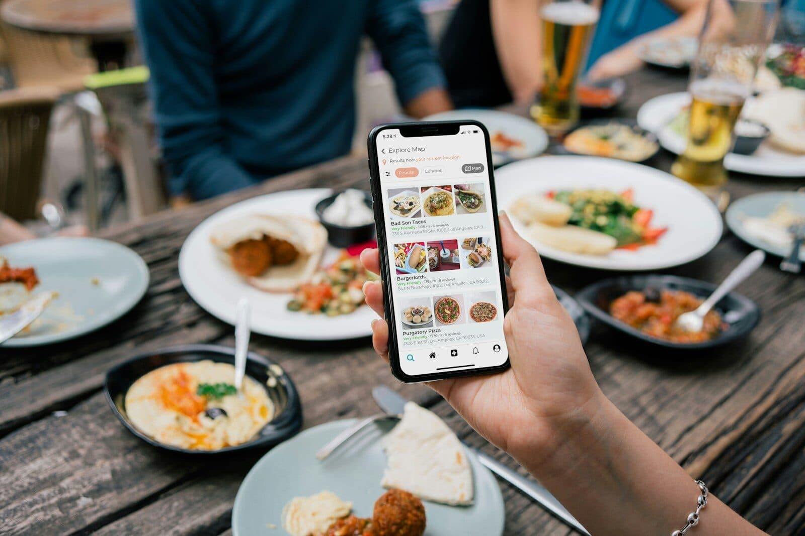 restaurant software; person holding white and black labeled card